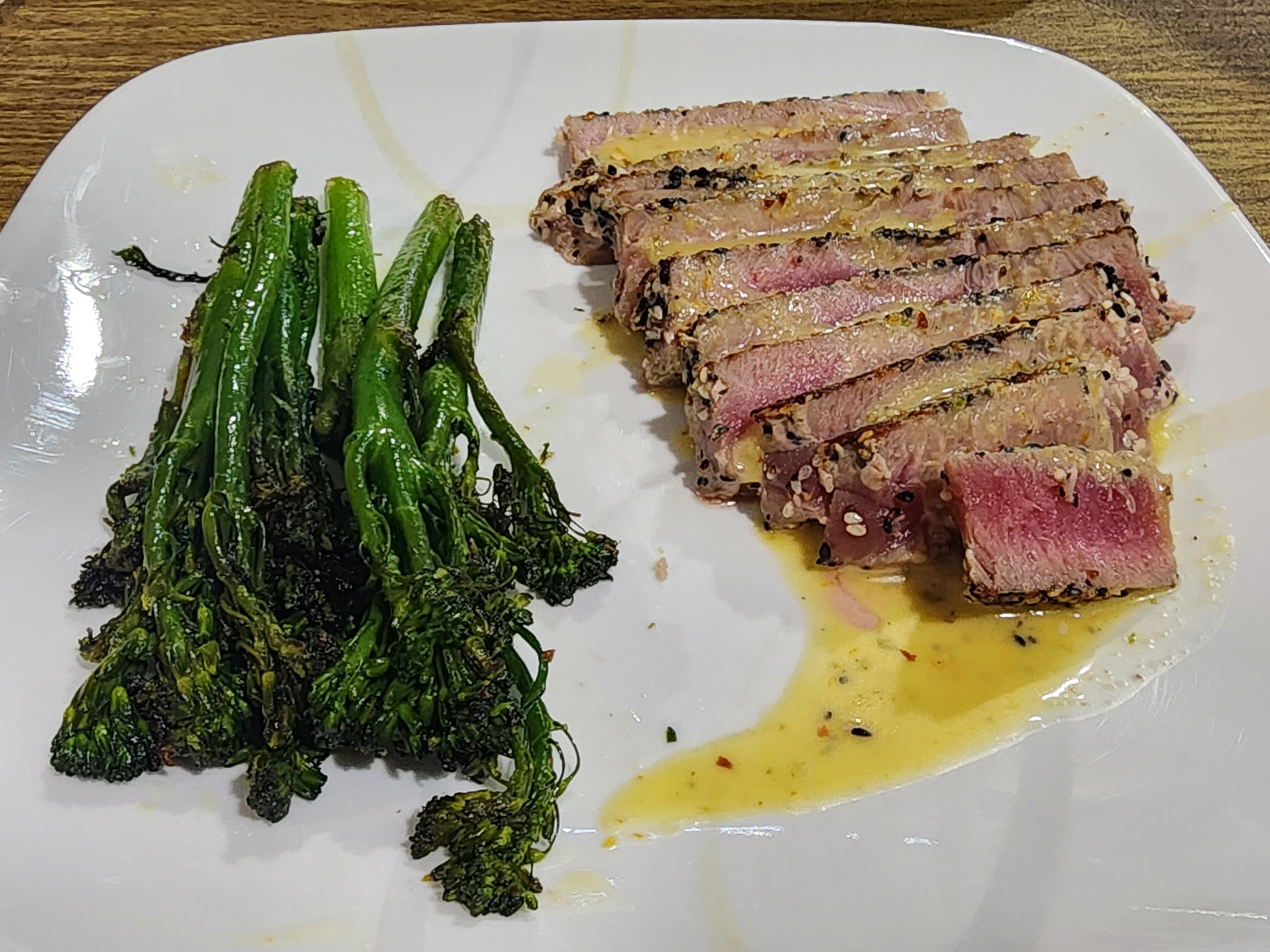Seared Sesame-Crusted Ahi Tuna with Citrus-Ginger Vinaigrette & Charred Broccolini